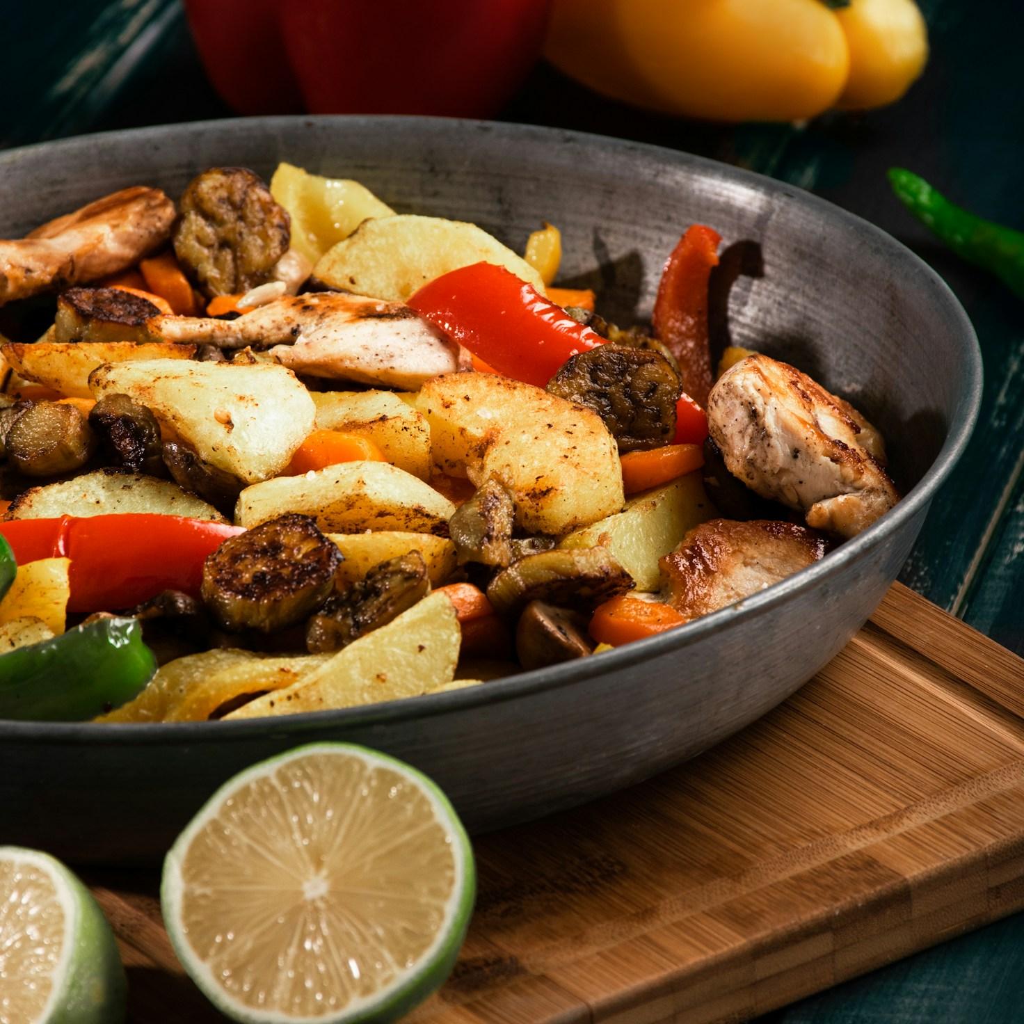 Diverse group of community members sharing a meal together, illustrating the bonds formed through collaborative cooking